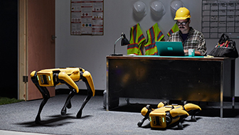 2 Boston Dynamics Spots waiting in the construction site office