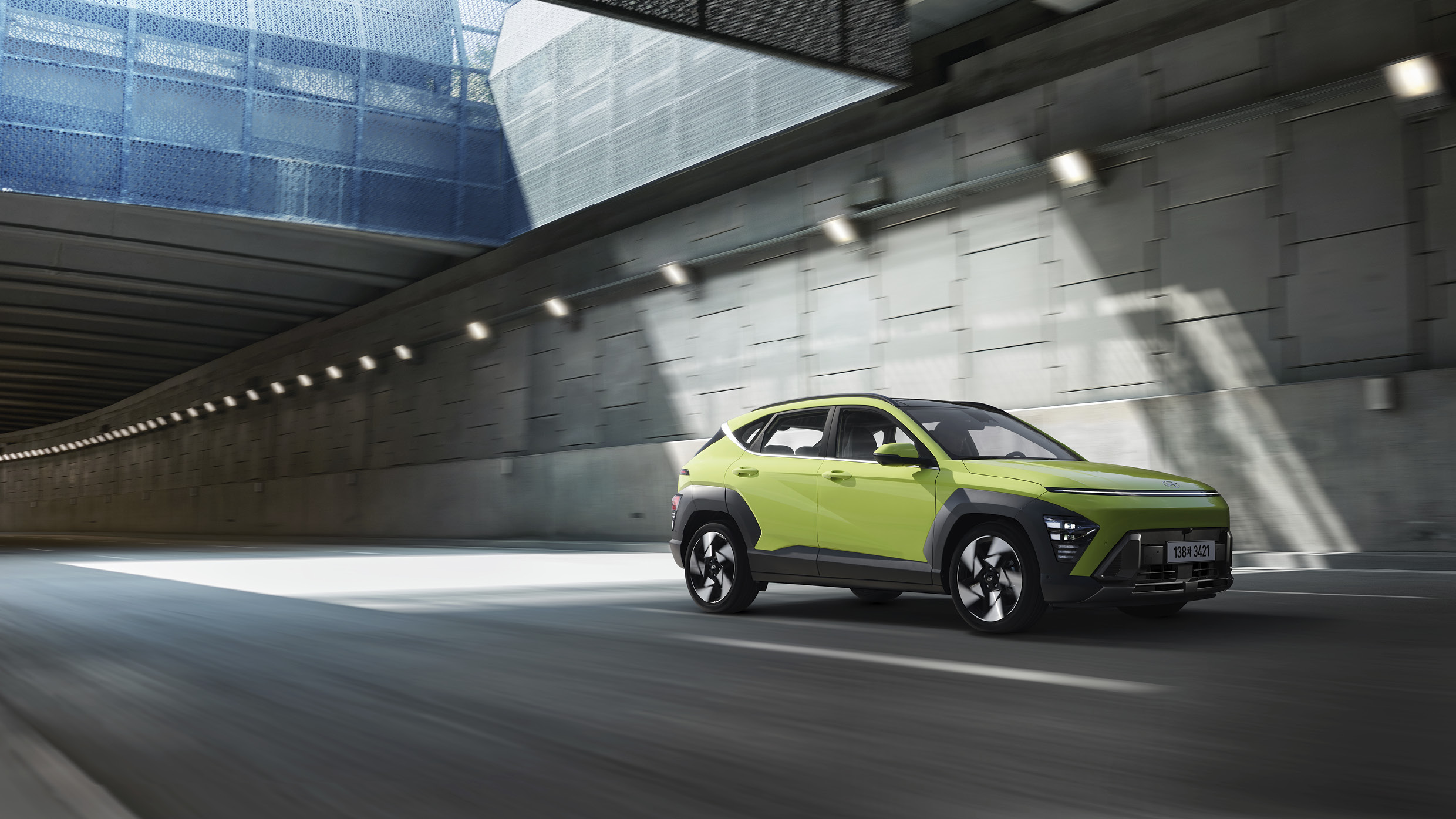 Front view of green Kona driving