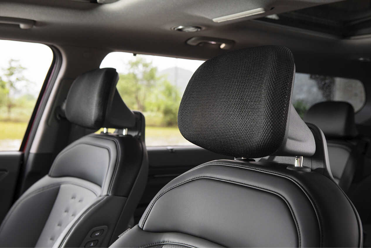 A mesh-type headrest in the first row of EV9
