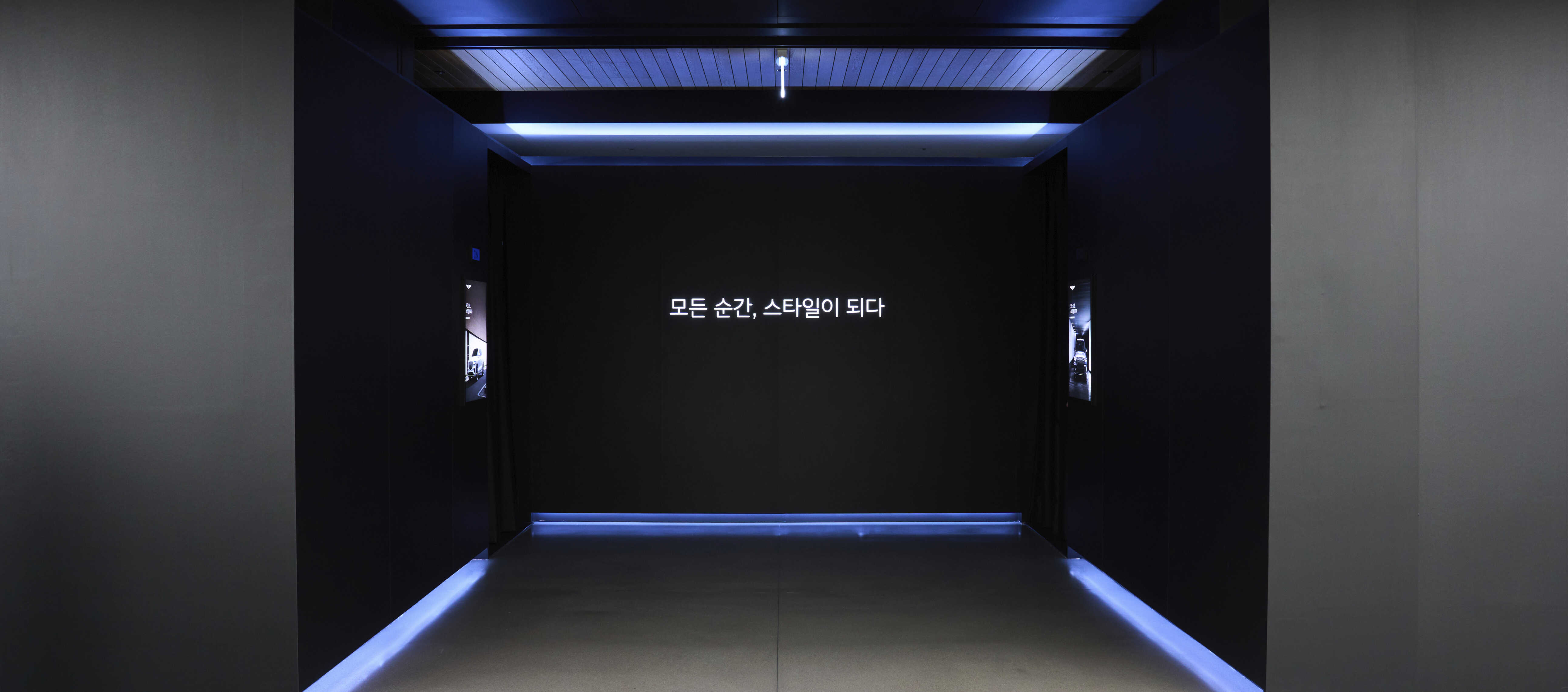 The view of two indirectly illuminated entrances in the interior exhibition hall