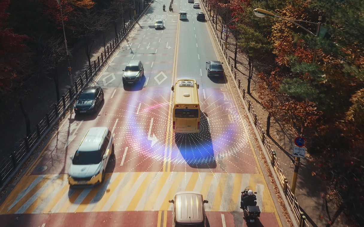 A bus equipped with vision pulses is running on the road