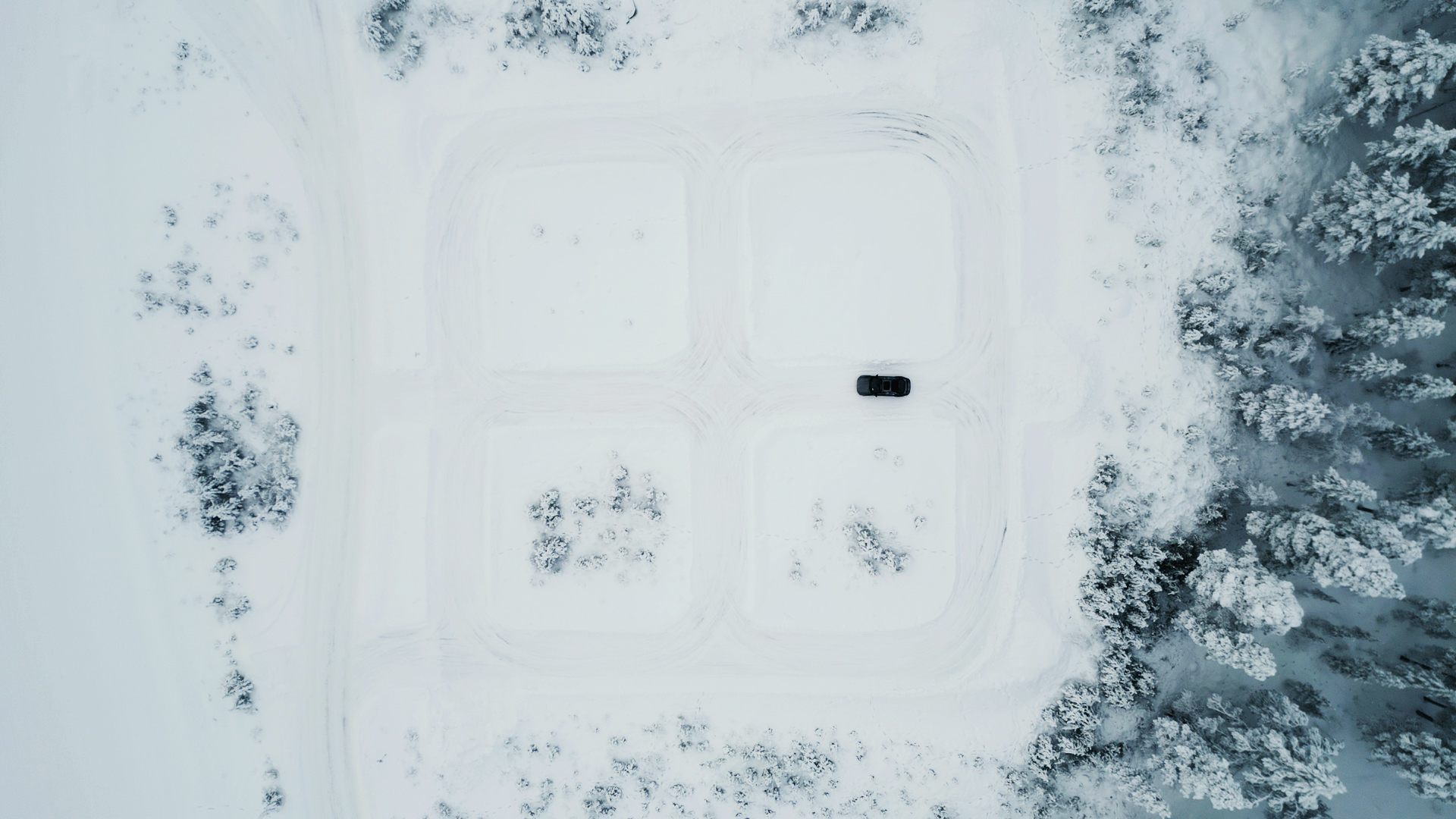 Top-down aerial image of a snow-covered testing track