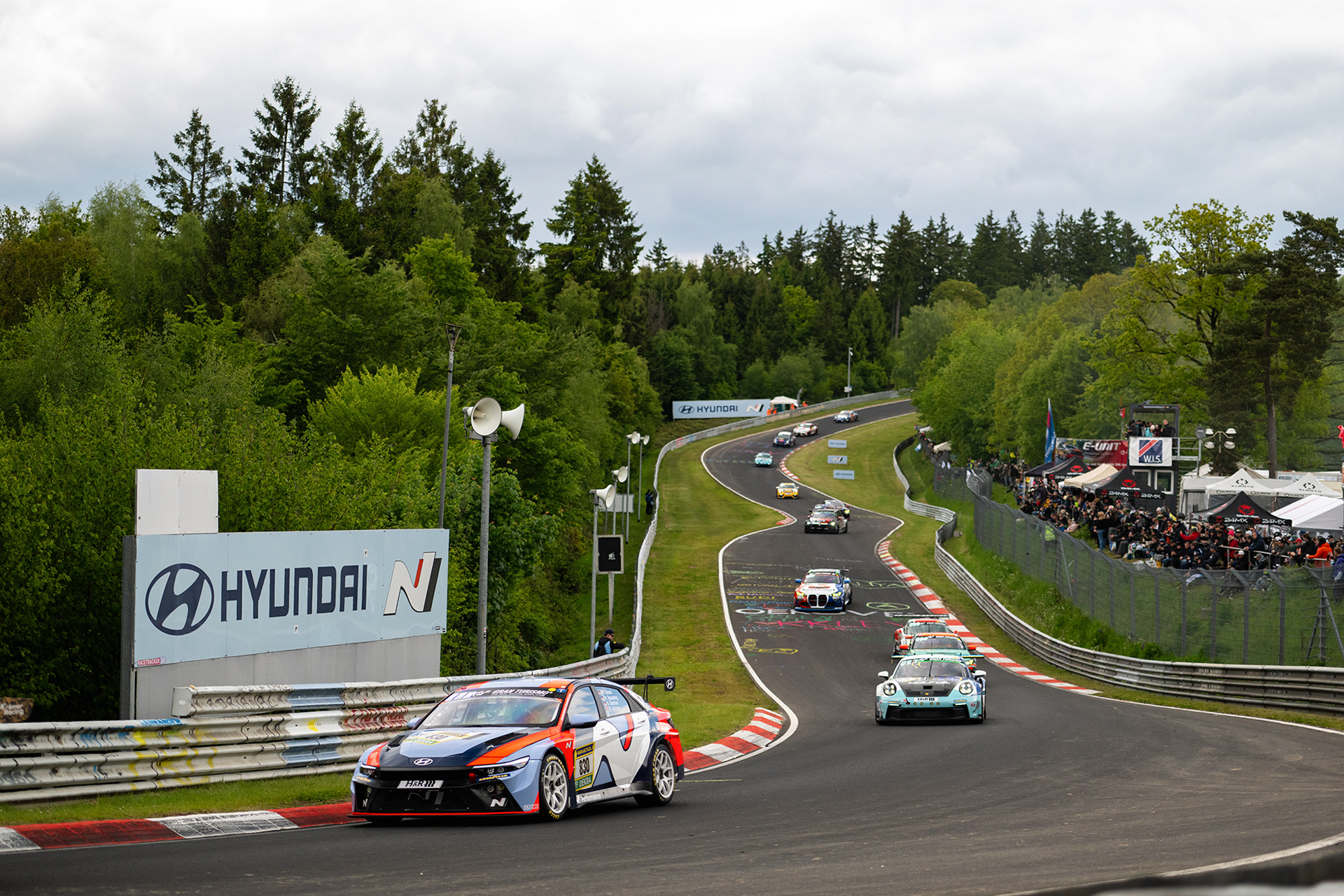 Race cars navigating a corner section of the circuit