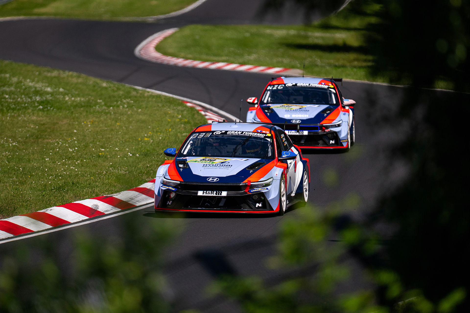A Hyundai N race car driving on the circuit