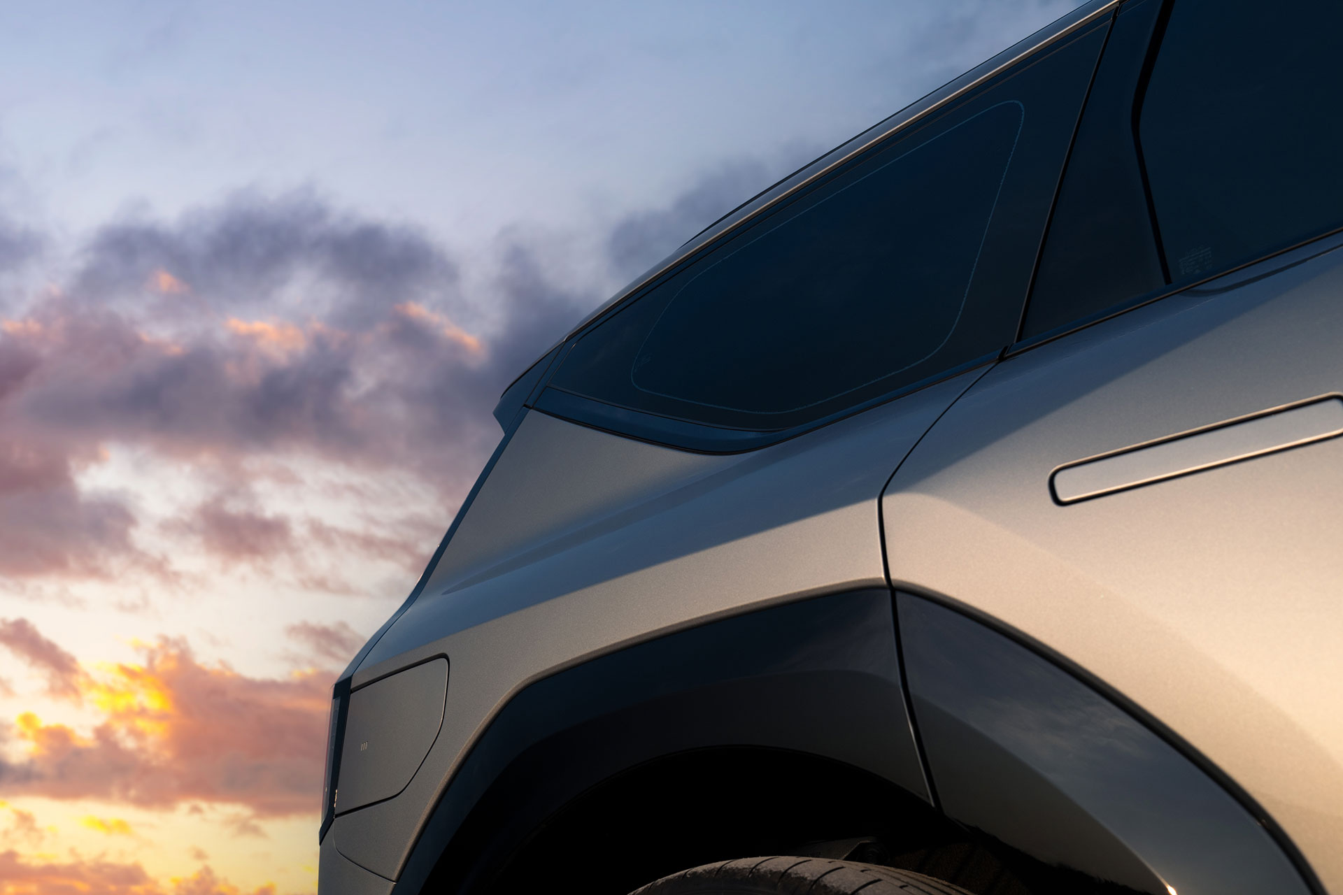 The rear-side view of the EV9 GT vehicle.