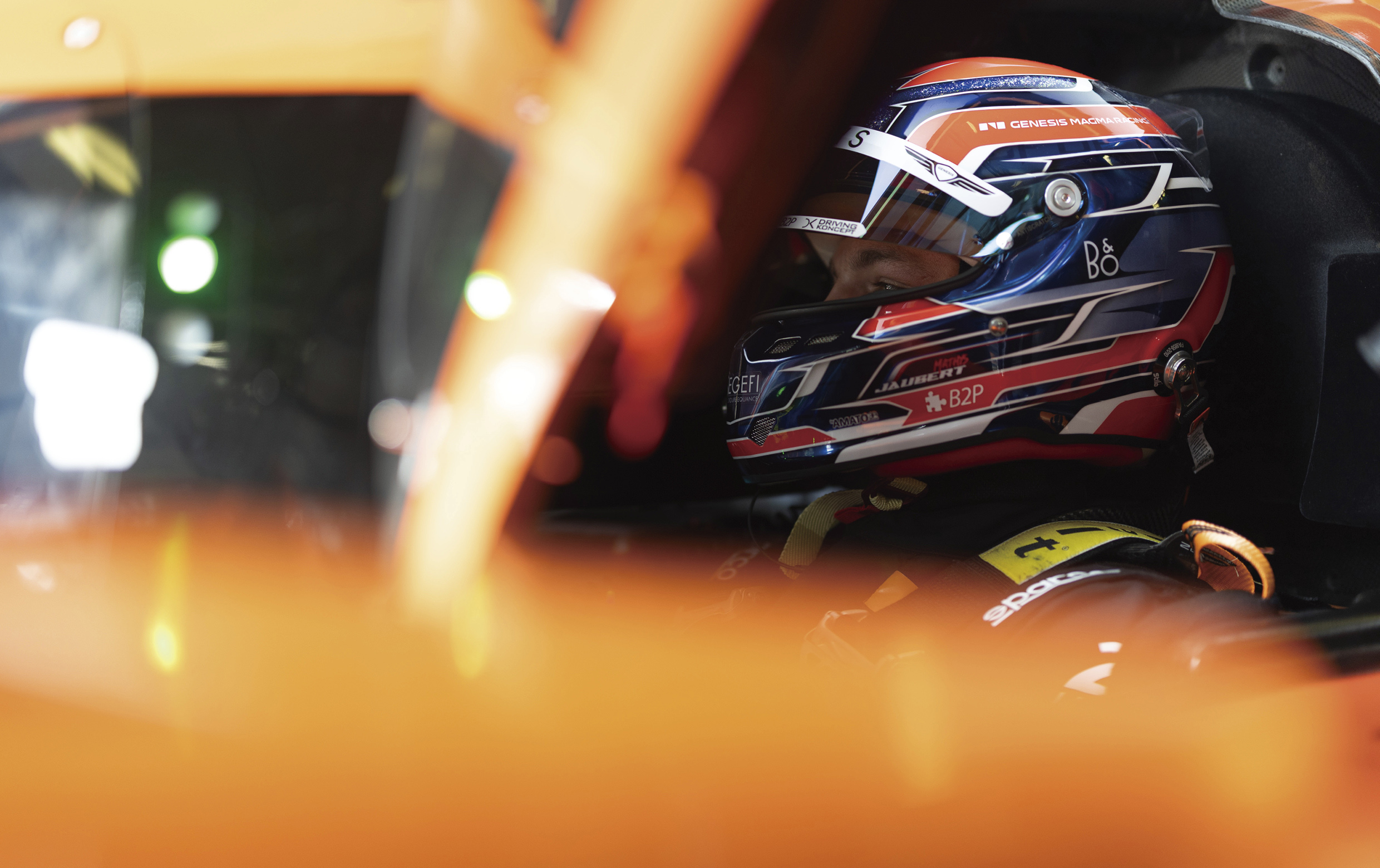 A driver in a hypercar is preparing for the race.