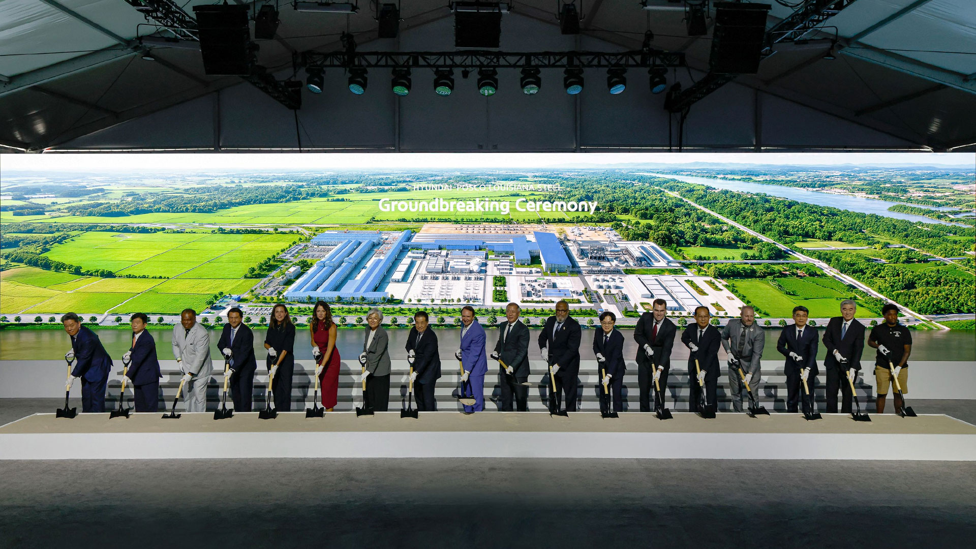 Key attendees at the groundbreaking ceremony break ground to mark the start of factory construction. From left: Hyundai Motor Group President Gang-hyeon Seo; POSCO Vice President Gwang-mu Kim; Donaldsonville Mayor Leroy Sullivan; Hyundai Motor Company President José Muñoz; Louisiana Secretary of Economic Development Susan Bourgeois; U.S. Representative Julia Letlow; Republic of Korea Ambassador to the United States Kyung-wha Kang; POSCO Group Chairman In-hwa Jang; Louisiana Governor Jeff Landry; Hyundai Motor Group Executive Chair Euisun Chung; U.S. Representative Troy Carter; Minister of Trade, Industry and Energy Jeong-kwan Kim; William Kimmitt, Deputy Under Secretary of Commerce for International Trade; Hyundai Steel President Bo-ryong Lee; Ascension Parish President Clint Cointment; Kia President Ho-sung Song; Hyundai Motor Group President Sung Kim; and River Parishes Community College (RPCC) student Cortaz Johnson.