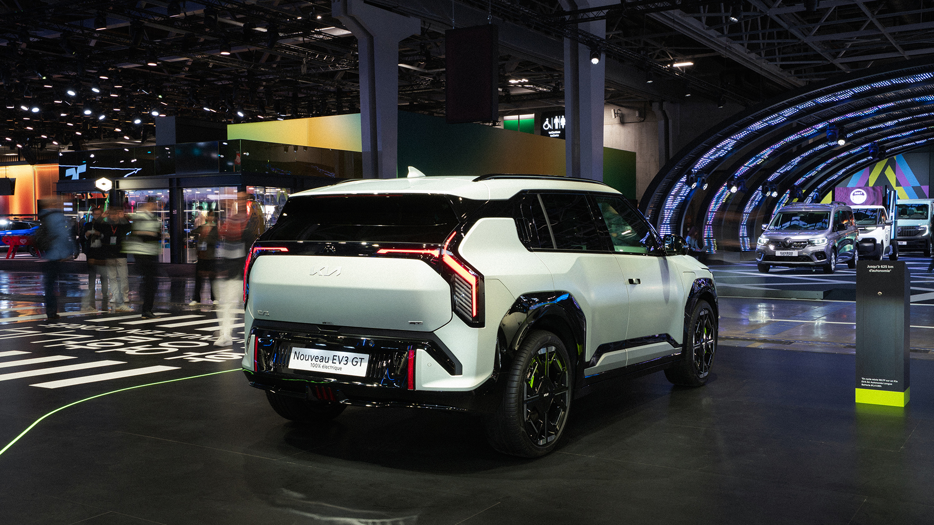 Rear three-quarter view of the Kia EV3 vehicle displayed at the 2026 Paris Motor Show exhibition hall